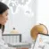 Travel agency accountant managing client deposits, vendor payments, and commissions on a laptop